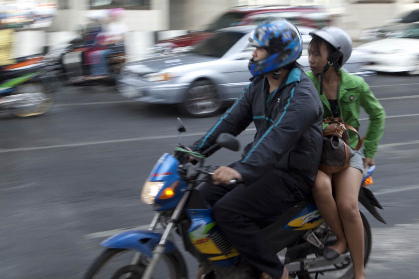 girl on Bangkok motorcycle taxi