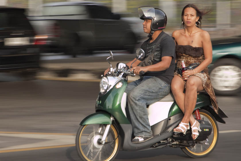 transgendered person rides a Bangkok motorcycle